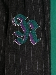 Штаны с зелеными лампасами от бренда JOHN RICHMOND