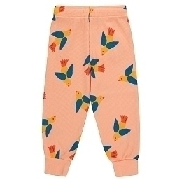 Джоггеры оранжевого цвета с птичками от бренда Tinycottons