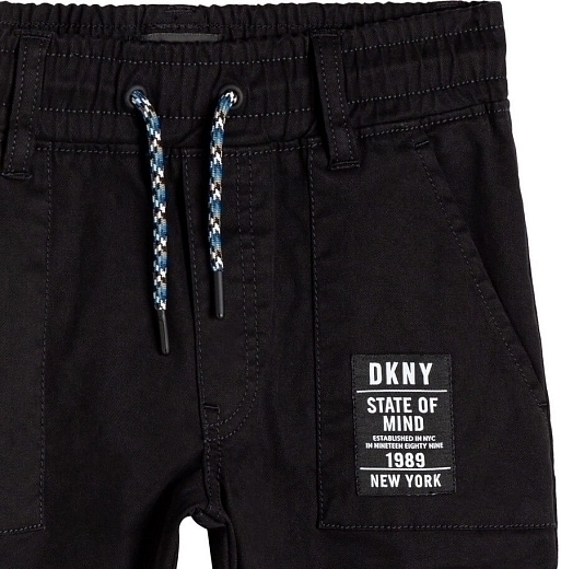Брюки черного цвета прямого кроя от бренда DKNY